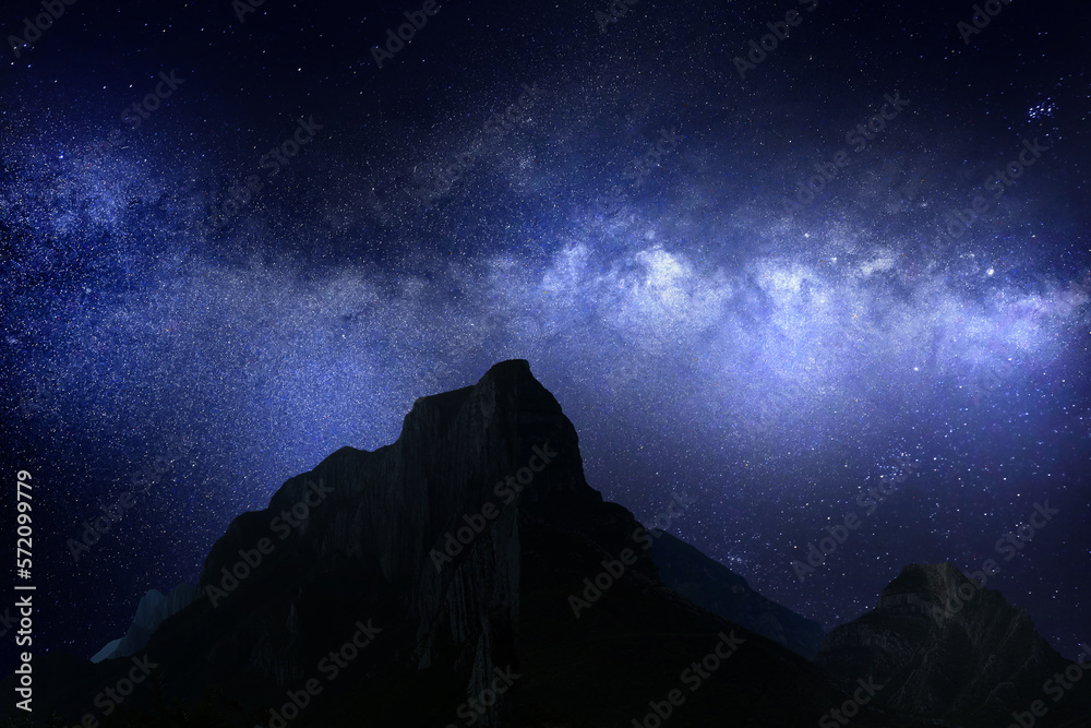 Picturesque view of starry sky over mountains at night