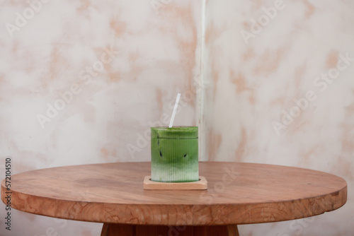 Iced matcha greentea on wooden table