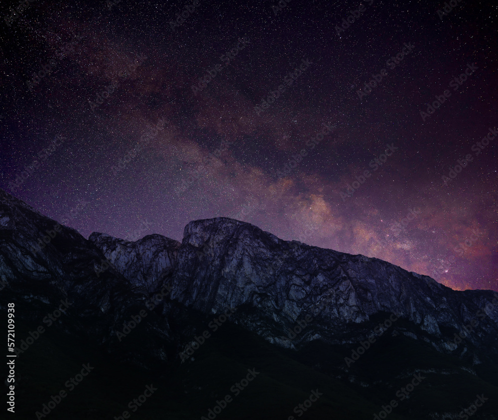 Picturesque view of starry night sky over mountains