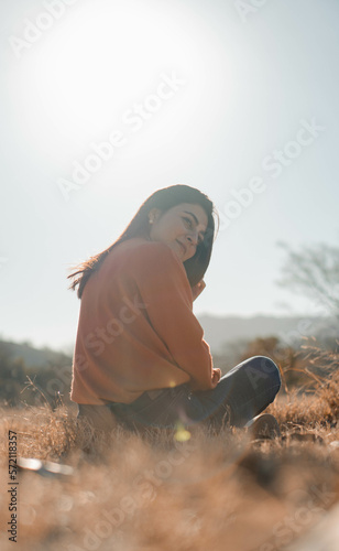 woman sitting in the field