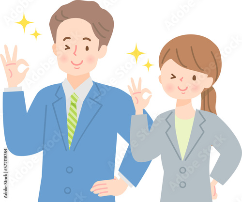 笑顔でOKサインをする若い男女