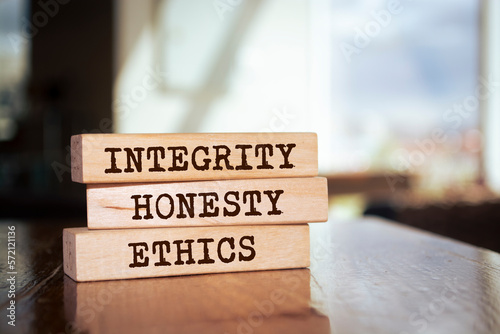 Wooden blocks with words 'integrity, HONESTY, ETHICS'.