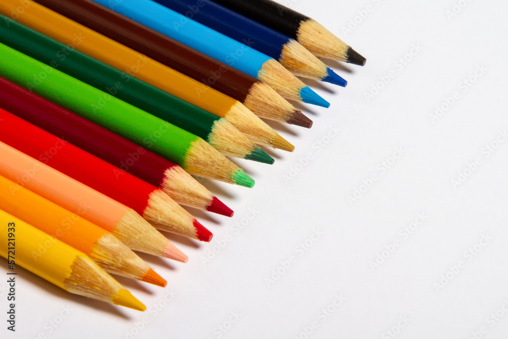 Set of colored pencils on white background. School concept. School education materials, copy space, top view. Set of colored pencils on white background. School concept. School education materials, copy space, top view.