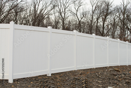 white vinyl fence in residential neighborhood