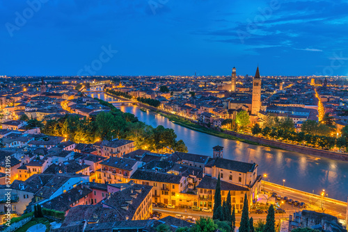 Verona Italy, high angle view night city skyline at Adige river