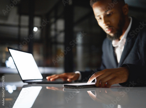 Laptop screen, phone and black man at night for fintech management, trading and stock market data analysis. Finance, accounting and business person with omnichannel for global investment and mockup