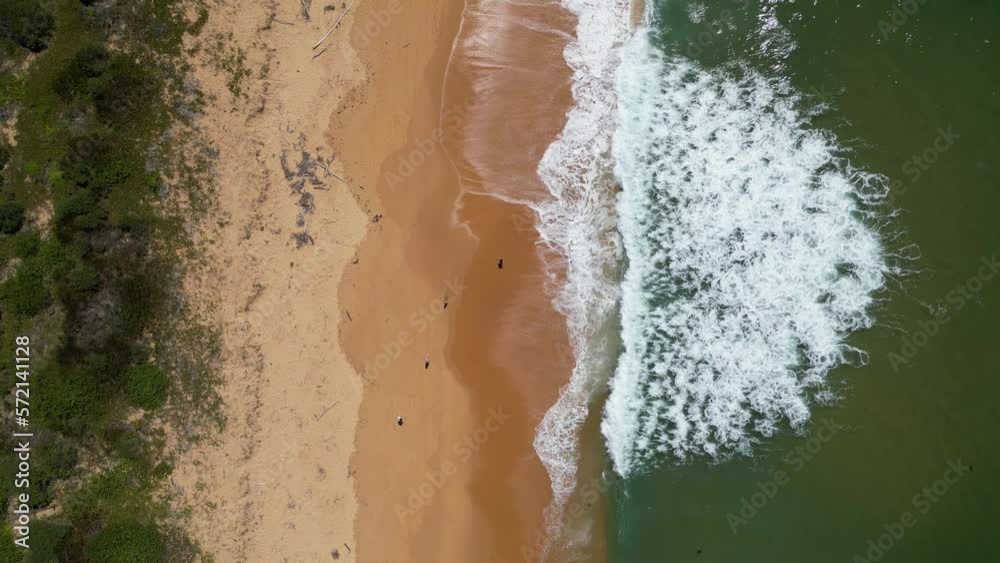 Foam getting produced by waves crushing onto Putty Beach, NSW Australia Foam getting produced by waves crushing onto Putty Beach, NSW Australia