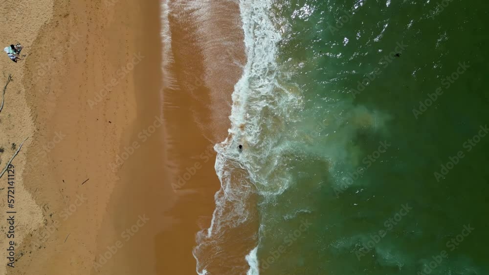 Coming down on a person walking at the waterline. NSW Australia Coming down on a person walking at the waterline. NSW Australia