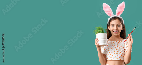 Little girl with plant, bru...