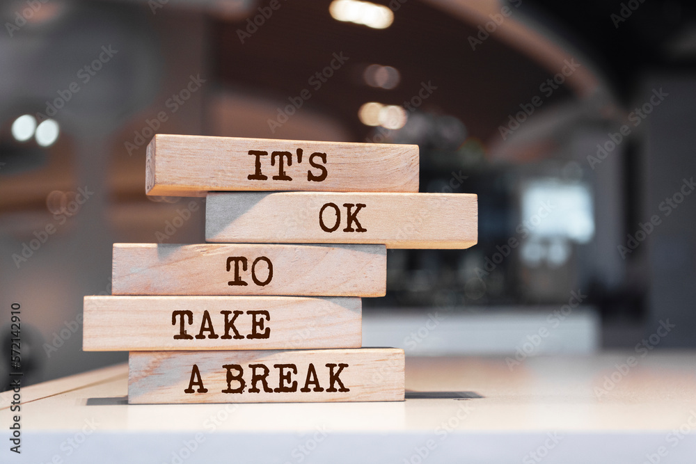 Wooden blocks with words 'it's ok to take a break'.
