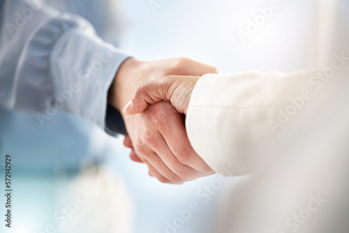 Hand, handshake and partnership for trust, unity or deal in agreement, meeting or b2b at office. People shaking hands in collaboration for support, welcome or promotion in solidarity at workplace