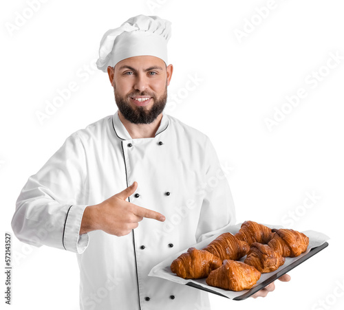 Male baker pointing at tray...