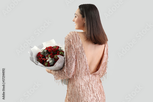Elegant woman in sequin dre...