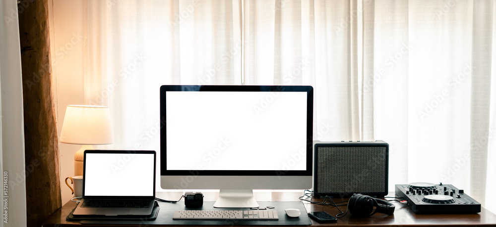 Mock up. Laptop and computer white screen on the table in the home office Mock up. Laptop and computer white screen on the table in the home office
