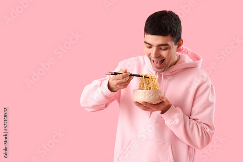 Young man with bowl of Chin...