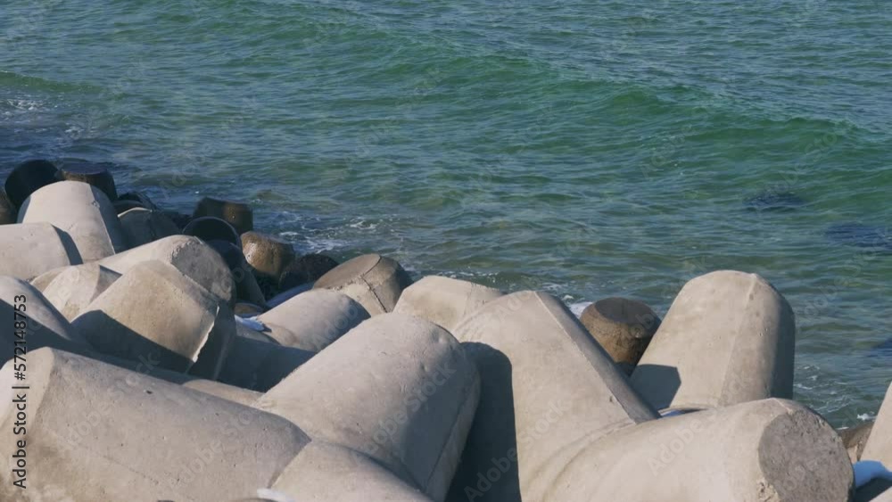 Waves of the sea peacefully crashed into the tetrapod Waves of the sea peacefully crashed into the tetrapod