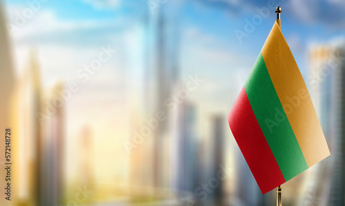 A small Lithuania flag on an abstract blurry background photo