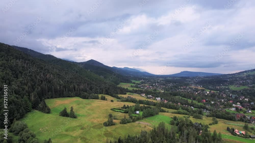 Drone view. Bird's eye. Mountain landscape with forests and fields. Zakopane, Poland Drone view. Bird's eye. Mountain landscape with forests and fields. Zakopane, Poland