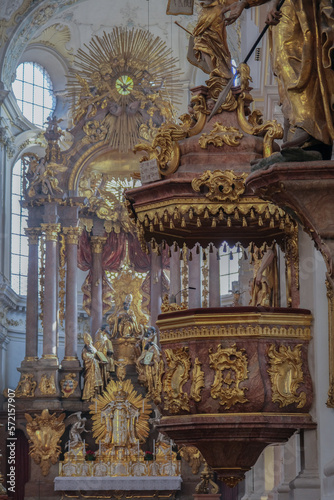 Magnificent opulent splendid Bavarian baroque church cathedral basilica interiors with stucco, murals, altar, Pilars, ceiling paintings, gold, wood domes nave © Tamme