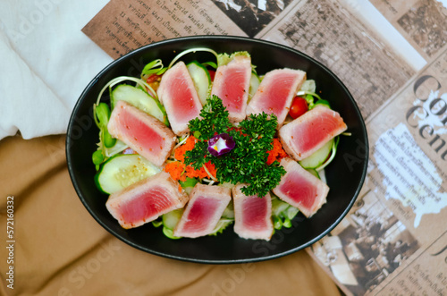 Fresh Tuna Salad Served with Cucumber Roe and Tomato Lettuce Garnished with Salad and Sesame Oil Sauce