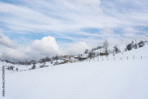 Winter Landscape with Small Village Houses Between Snow Covered Forest in Cold Mountains. Giresun - Turkey