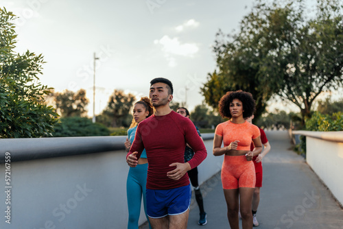 Diverse athletes running in urban area