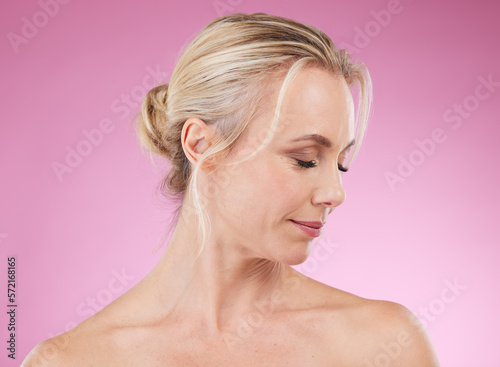 Beauty  skincare and profile of mature woman with eyes closed  glowing skin and hair  natural spa makeup in studio. Mockup  advertising and luxury cosmetic  face of model isolated on pink background.