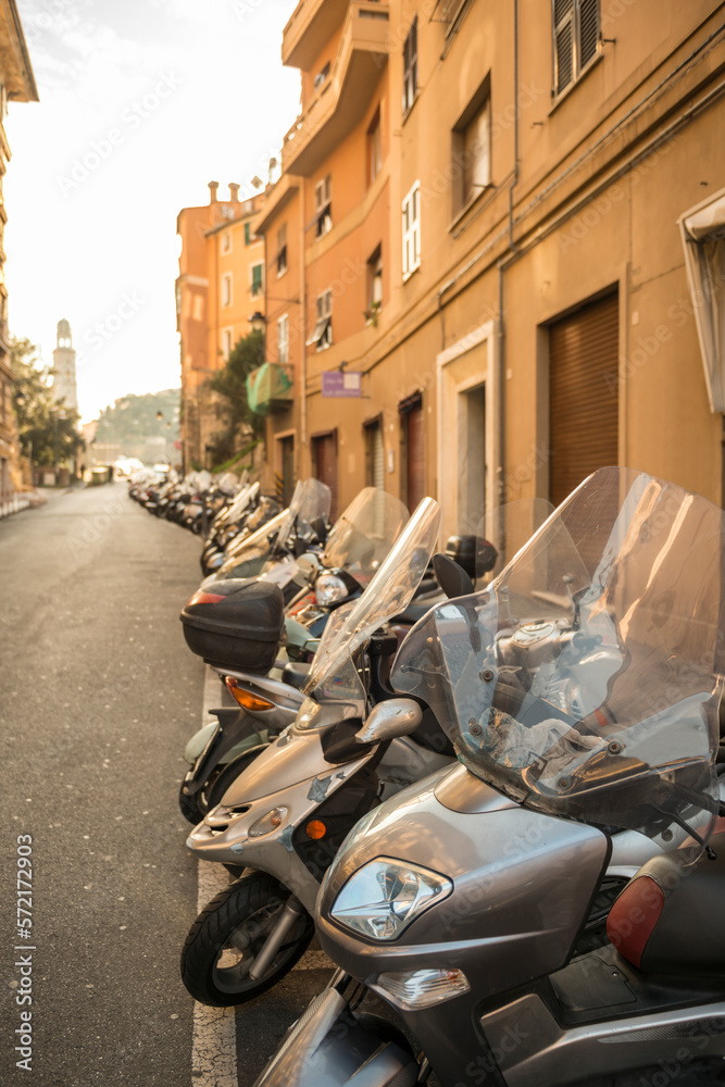 Many Motorcycles in a Row in City of Genoa, Liguria in Italy.