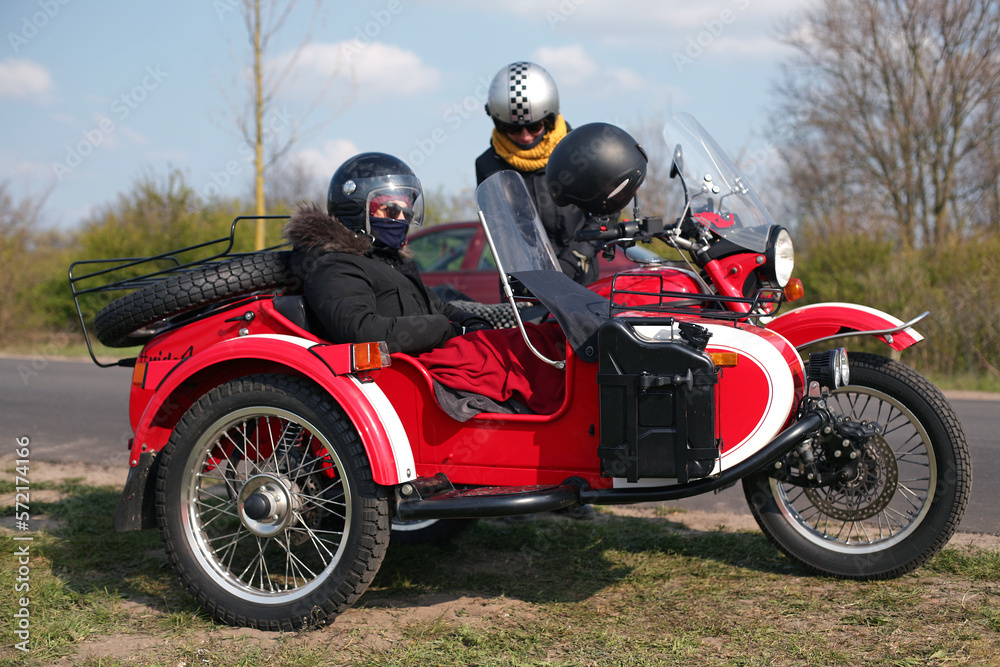 Two people get ready for a motorcycle adventure in winter. Two people get ready for a motorcycle adventure in winter.