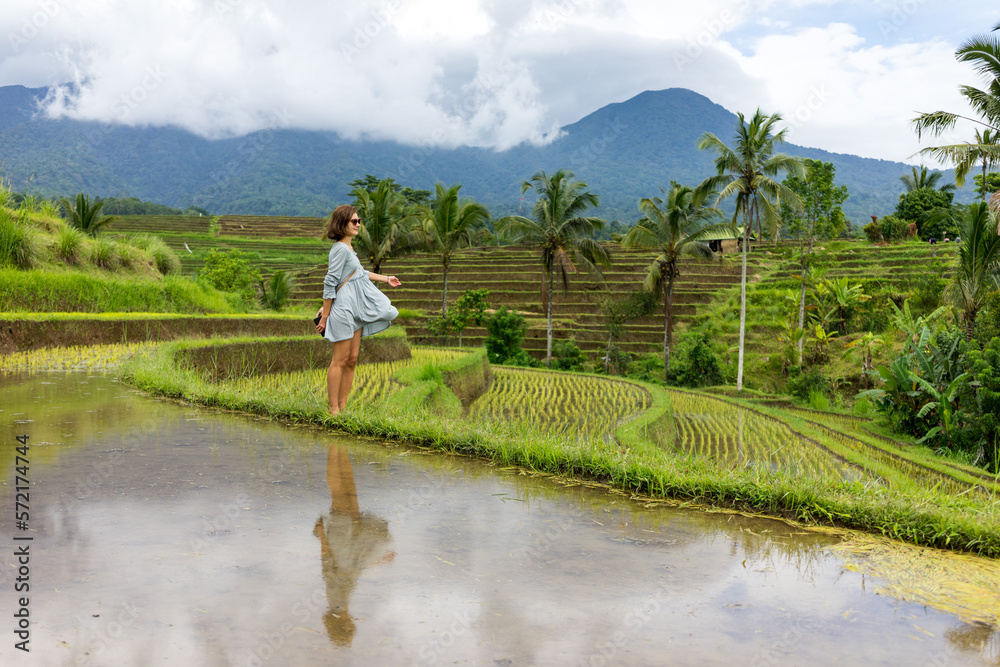 Young lady is dancing in the rice fields Young lady is dancing in the rice fields