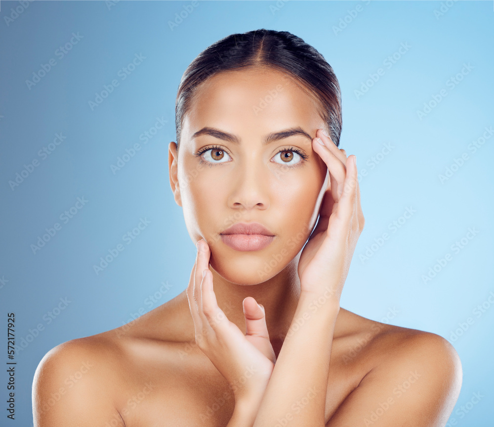 Woman feel face for beauty, skincare and blue background of wellness, cosmetics and salon spa results. Portrait, facial and studio model with healthy aesthetic, laser dermatology and natural makeup