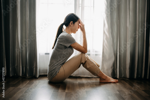 woman sit Depression Dark haired pensive glance Standing by window and anxiety Copy space. ..