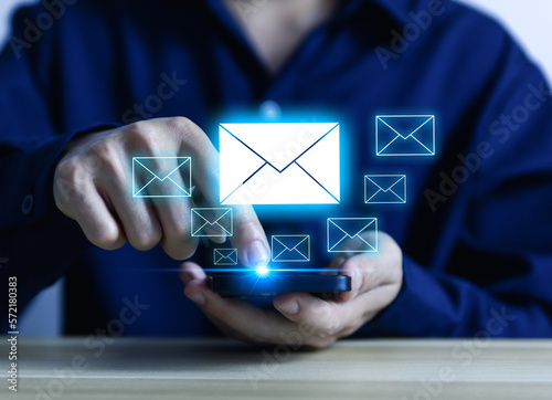 Businessman sending a letter from a smartphone. electronic mail concept is online communication on the Internet network Receiving	
