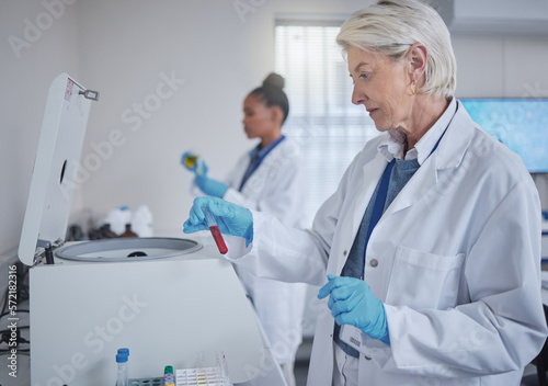 Science  laboratory or woman with blood in test tube for medical search  healthcare or dna research. Biotechnology  medicine lab or scientists doctor with fluid sample analysis  study or innovation
