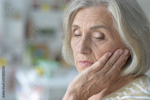 portrait of sad sick senior old woman