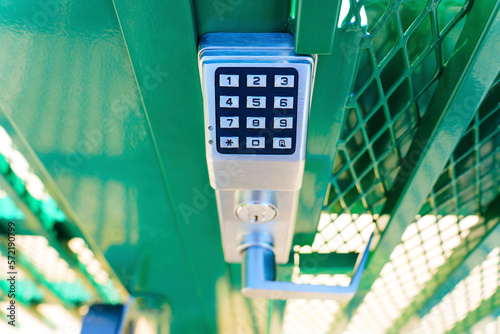 Top view of a keypad entry gate lock outdoors photo