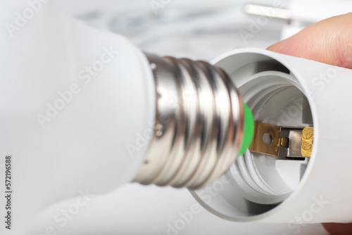 Schilderij op canvas White lamp socket and lamp bulb, Electric cartridge for light bulbs, lamp holder