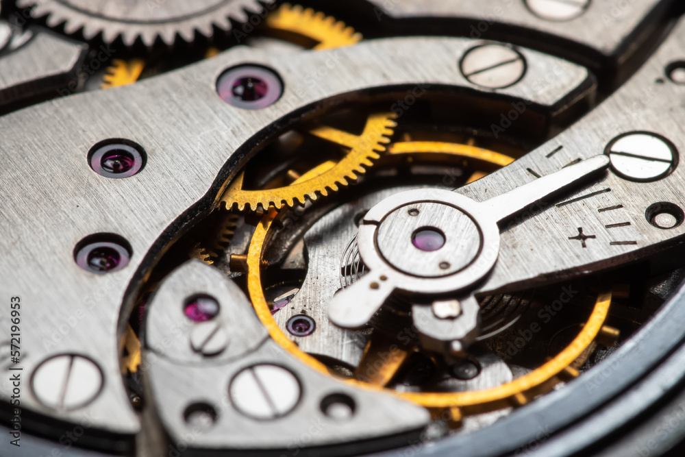 The mechanism of analog hours. A photo close up The mechanism of analog hours. A photo close up