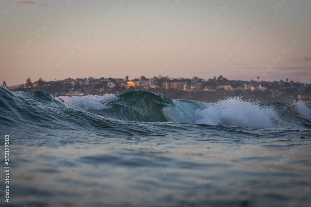 Wave barrel breaking on the shore.