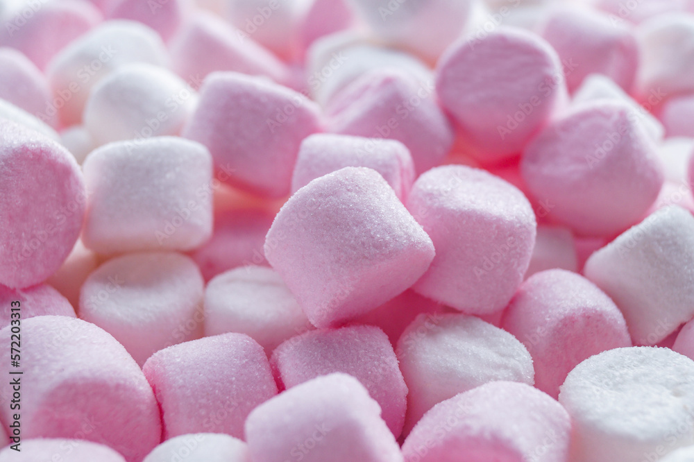Delicious puffy pink and white marshmallows as background, closeup Delicious puffy pink and white marshmallows as background, closeup