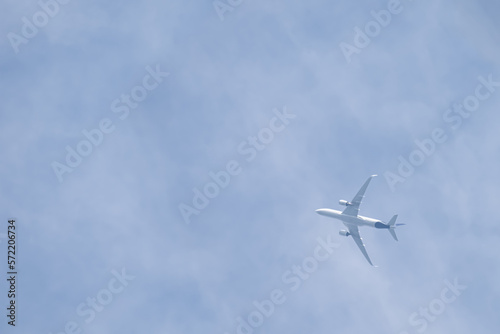 Plane in blue sky with clouds
