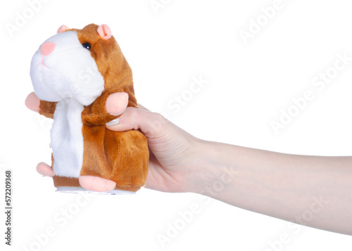 soft toy hamster in hand on white background isolation photo