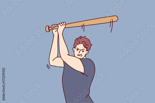 Aggressive man swings wooden bat to hit ball or fend off attacking criminals. Aggressive guy attacks people using baseball bat as weapon, wanting to beat and injure opponent after argument 