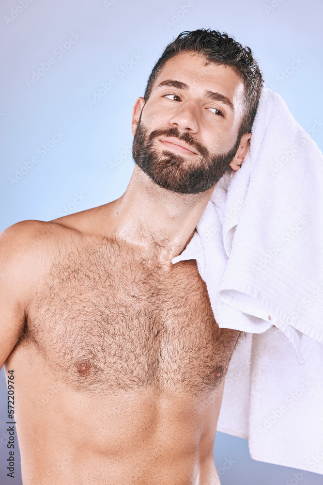 Man, shower with hygiene, towel and grooming for beauty in, smile and face in studio. Skincare, natural cosmetics and cleaning body with healthy skin, fresh and cosmetic care on blue background Man, shower with hygiene, towel and grooming for beauty in, smile and face in studio. Skincare, natural cosmetics and cleaning body with healthy skin, fresh and cosmetic care on blue background