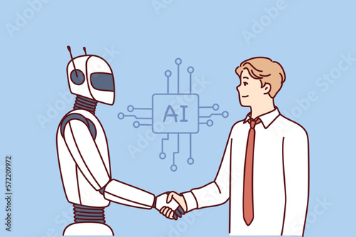 Man shakes hands with robot as sign of friendship between humans and artificial intelligence AI. Concept developing technologies equipped with artificial intelligence and neuron networks 