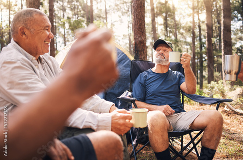 Camping, trekking and senior men with coffee in nature enjoying drink, toasting in retirement celebration or travel. Elderly friends raising cup on camp chairs for friendship adventure in the forest