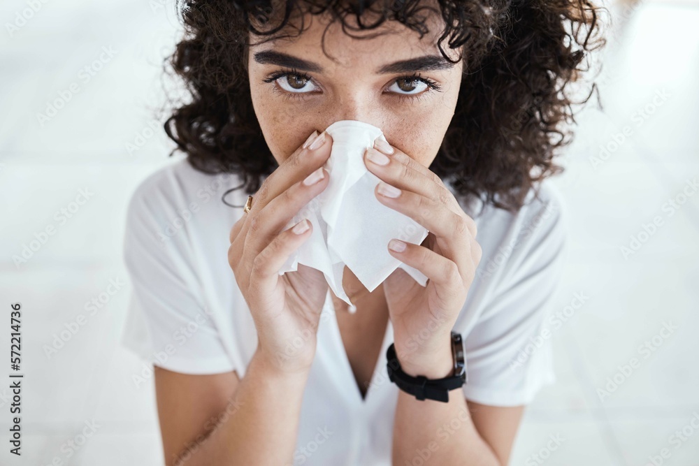 Black woman, tissue and blowing nose in home for portrait with allergies, sneeze and blurred background. Gen z girl, toilet paper and sick with allergy, covid and closeup in house, apartment or room Black woman, tissue and blowing nose in home for portrait with allergies, sneeze and blurred background. Gen z girl, toilet paper and sick with allergy, covid and closeup in house, apartment or room