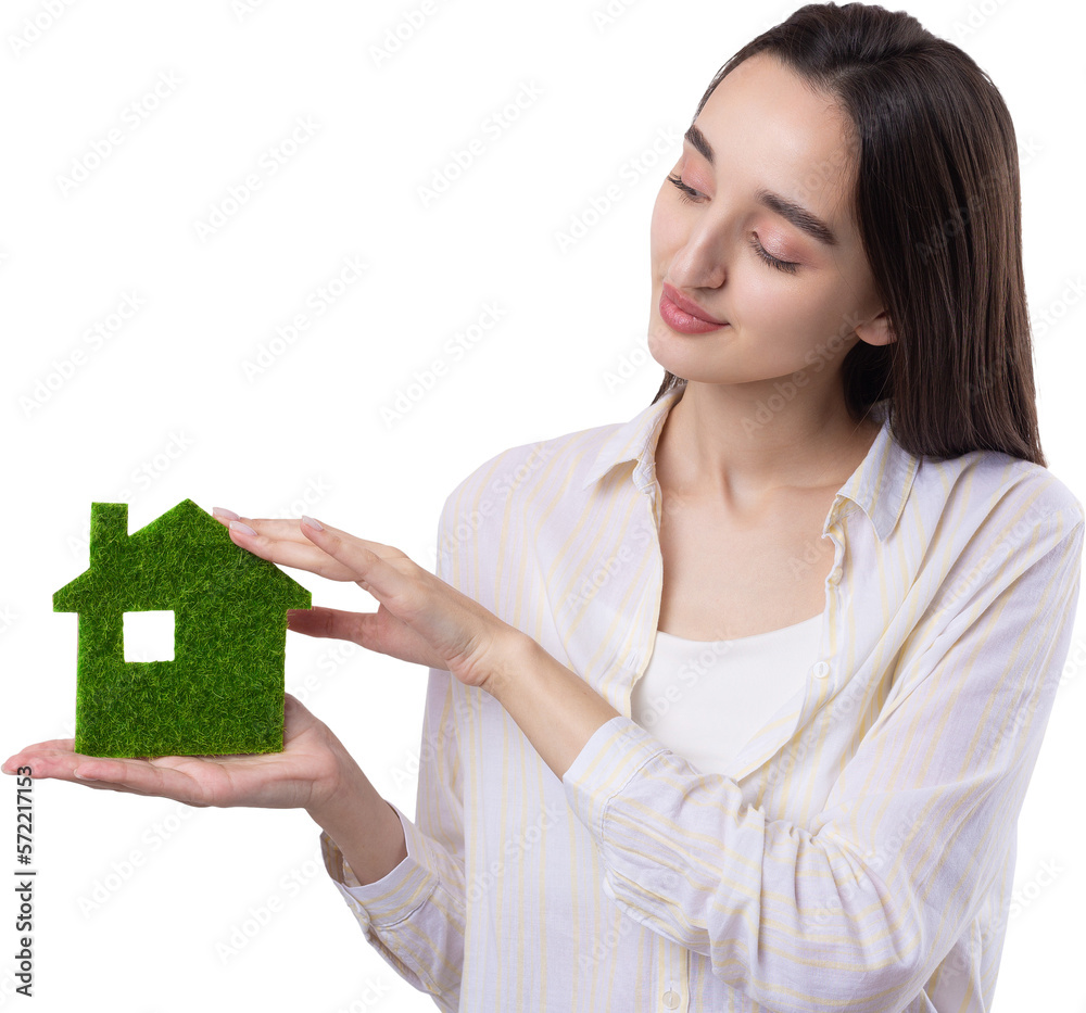 A young girl realtor holds a model of a green house in her hands. Sale of ecological real estate. A young girl realtor holds a model of a green house in her hands. Sale of ecological real estate.
