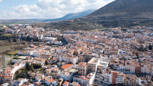 Aerial photo from drone to city of Loja and Church of the Incarnation with Moorish Alcazaba and Gorda Peak at Loja ,Granada, Andalusia, Spain, Europe (Series)