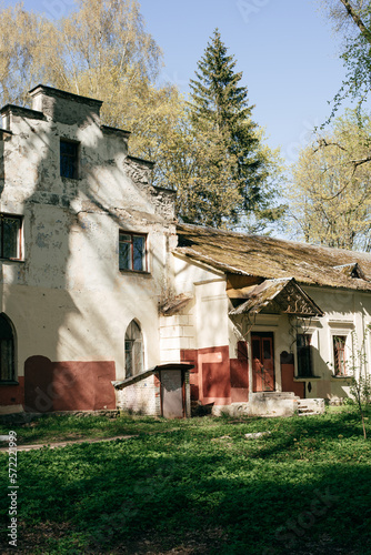 Panoramic, old manor house with trees.  photo